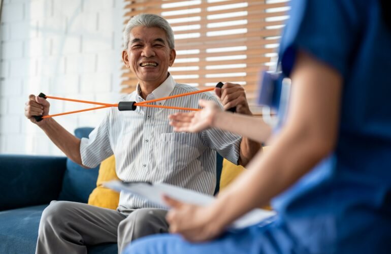 Asian senior elderly man doing physiotherapist with support from nurse.