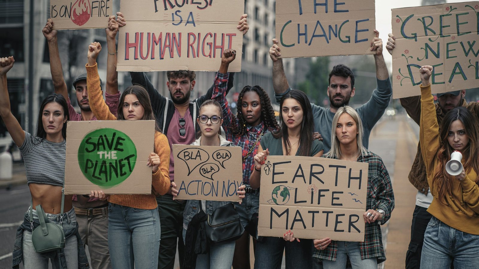 Crowd of young people protesting against climate policy and global warming