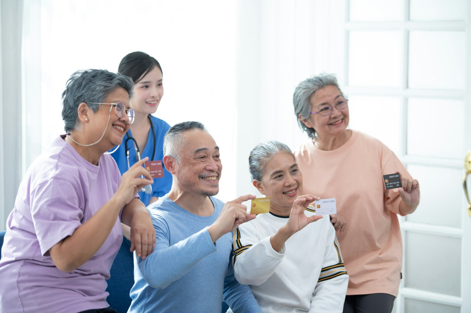 Old people's companions displaying a credit card to guarantee the availability of funds